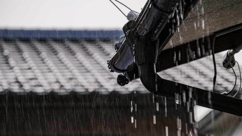 Is Your Akiya Ready for Typhoon Season? Traditional Japanese house during heavy rain and strong winds as a typhoon passes through the Kansai region.